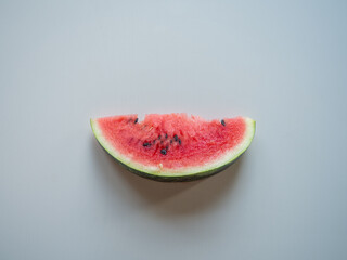 Juicy ripe watermelon in half on a white table