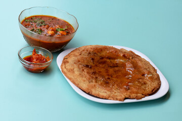 Indian flatbread - Aloo Kulcha with Choley or Stuffed Potato Bread or Stuffed Aloo paratha with tomato ketchup, white chickpeas & pickle - Image