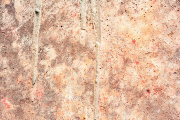 Texture of a concrete wall with cracks and scratches which can be used as a background