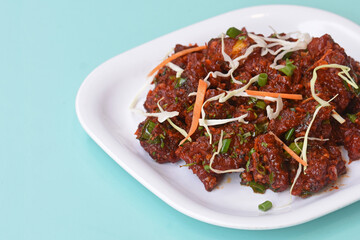 Paneer Tikka Kabab in red sauce - is an Indian dish made from chunks of cottage cheese marinated in spices ,chilli Paneer Kabab, Paneer 65,Spicy cottage cheese