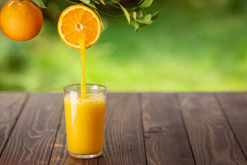 orange juice pouring into glass