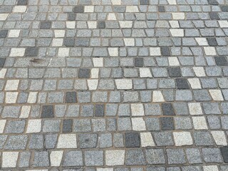 Different shaped and shaded floor tiles.