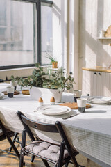 Modern kitchen. Table set for family meal at home. Interior design concept.