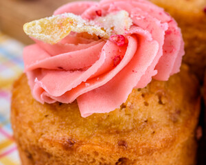 Raspberry Lemonade Cupcakes are on display above a colourful check pattern background