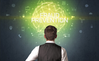 Rear view of a businessman with FRAUD PREVENTION inscription, online security concept