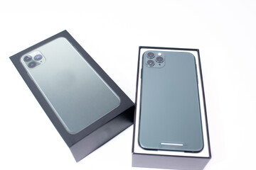 Green smartphone with three cameras on a white background