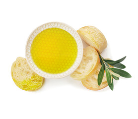 Bowl of tasty olive oil and bread on white background