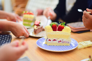 People eating dessert in coffee.