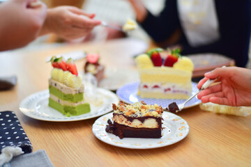 People eating dessert in coffee.
