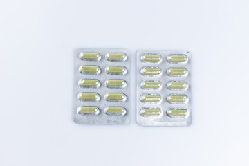 Close up,Andrographis Paniculata capsules (Herbal capsules) isolated on a white background