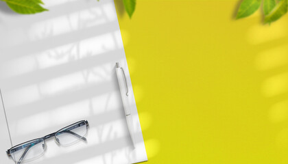 Closeup Letterhead with pen and free copyspace Mockup on yellow background