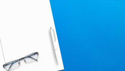 Closeup Letterhead with pen and free copyspace Mockup on blue background