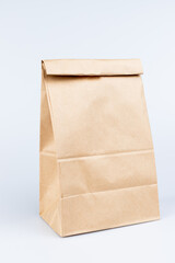 Brown paper bags on white background