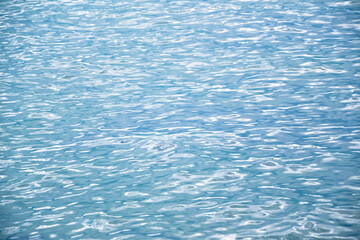 Sea water. Turquoise clear water. Summer background. Ocean in cloudy day.