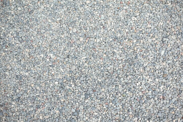 Abstract background of dry round stones in wide angle