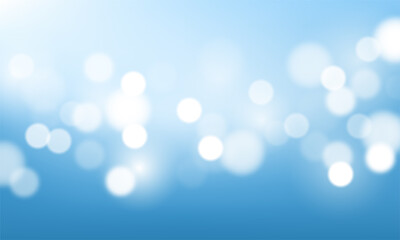 Blurred bright abstract bokeh on blue background	