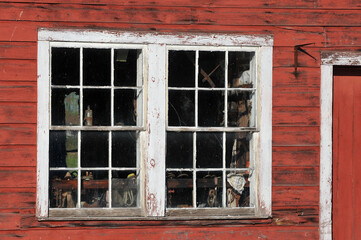Fototapeta na wymiar old wooden window of workshop with tools and equipment 