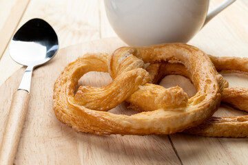 pretzels on wood table and black coffee