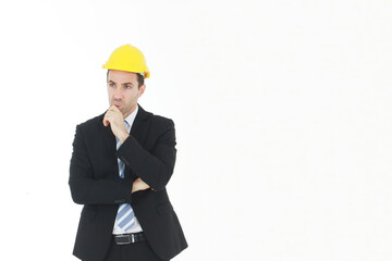 Handsome and smart engineer in black suit Wearing a yellow safety engineering hat Thinking and serious in work isolated on yellow background. Copy Space
