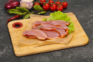 Sliced smoked duck breast served salad