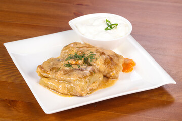 Homemade stuffed cabbage with cream