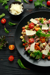 Mini potato gnocchi tricolour with tomato, spinach, Seasonal salad leaves and parmesan cheese