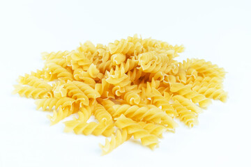 Raw pasta on a white background.