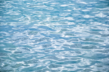 Sea water. Turquoise clear water. Summer background. Ocean in cloudy day.