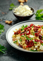 Orzo Pasta with sunshine dry tomato, black olives, walnut and feta cheese