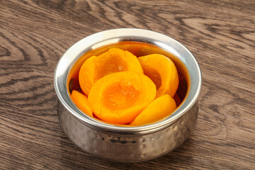 Marinated peaches fruit in the bowl