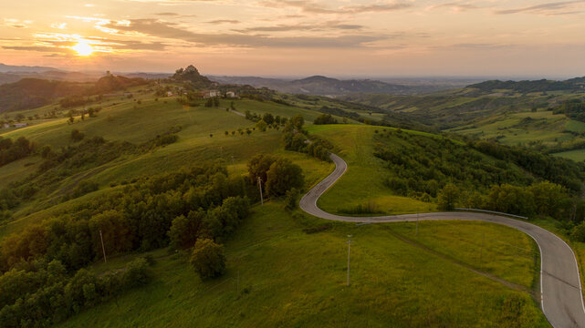 Badlands and rossena castle at sunset
