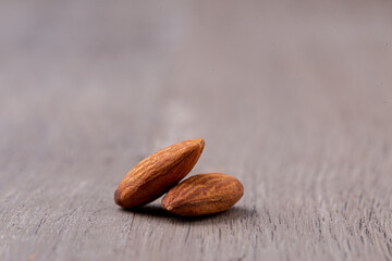 closed up almonds  on wooden table