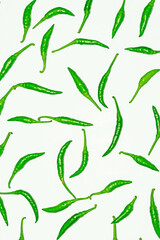 Fresh harvested green chili on white background.