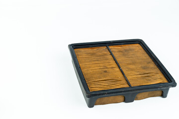 Close up dirty car air conditioner filter isolated on white - deep focus image.