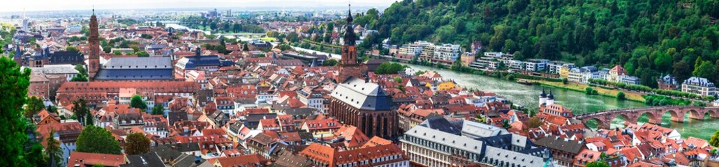 Obraz premium Heidelberg medieval cityscape panorama from above, Neckar River, Old Bridge and Castle, Baden-Württemberg, Germany Golden hour red roofs. Ultra high resolution world print quality, copy space 