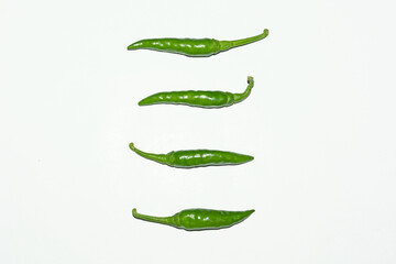 Fresh harvested green chili on white background.