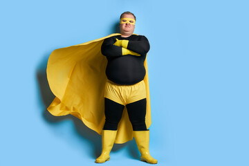 serious overweight super hero man is defender of the universe, strong guy has a mad desire, a dream...