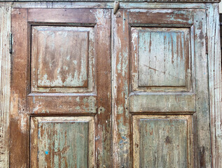View on isolated weathered old retro wardrobe wood door