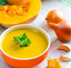 Pumpkin soup served on the table in bowl