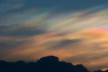iridescent clouds appear during the sunset.