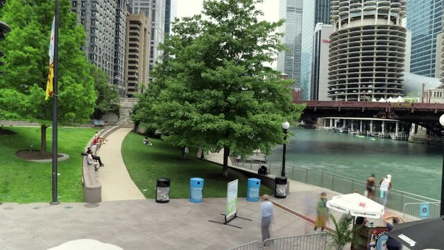 Chicago,IL/USA-July 18th 2020:  Time lapse of the Chicago River walk during a nice summer day in the city.  People are walking around during the pandemic Covid-19 living the new normal. 