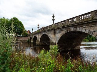 The 18th century Grade II listed 'Welsh Bridge' crosses the River Severn in Shrewsbury, UK.