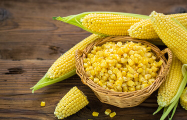 Fresh corn on cobs on the wooden table