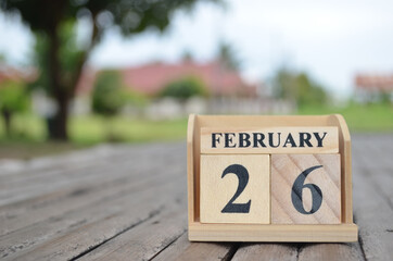 February 26, Number cube with a natural background.