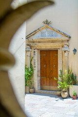 Nazareth, Israel. July 10, 2020: Synagogue Church in Nazareth through the grille of the gate. here...