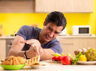 Man having hard choice between healthy and unhealthy food