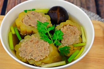 Stuffed bitter gourd with seasoned minced pork in clear soup.
