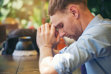 Prayer and bible concept. Caucasian man praying, hope for peace the world and free from coronavirus, Hand in hand together, believes and faith in christian religion at church.