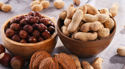 Composition with two bowls of hazelnuts and peanuts