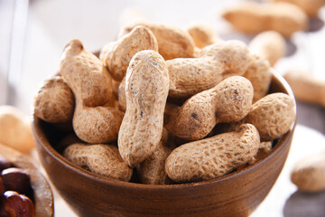 Composition with bowl of peanuts